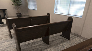 Two brown pews near window in the chapel at Boonespring Transitional Care Center and Rehabilitation in Boone Co. KY
