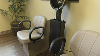 Two salon chairs with dryers in the hair salon at Boonespring Transitional Care Center and Rehabilitation in Boone Co., KY