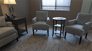 Two chairs and side table in living room at a transitional care center in Boone Co., KY