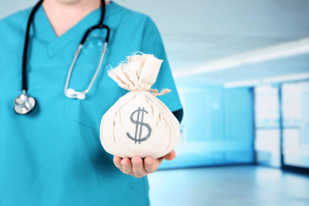 Health care worker hold money bag representing nursing home cost