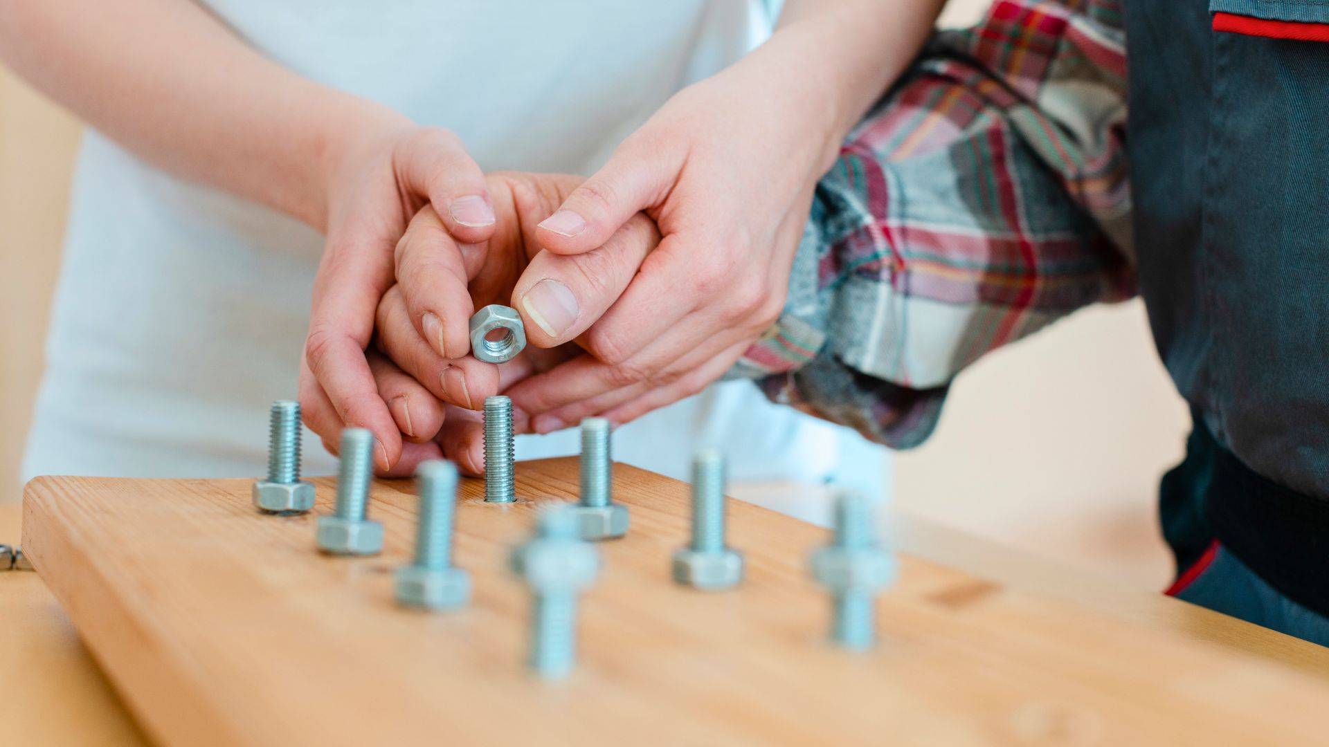 Occupational Therapy exercise with nuts and bolts