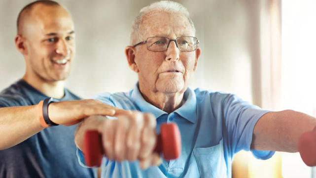 Senior man lifting hand weights