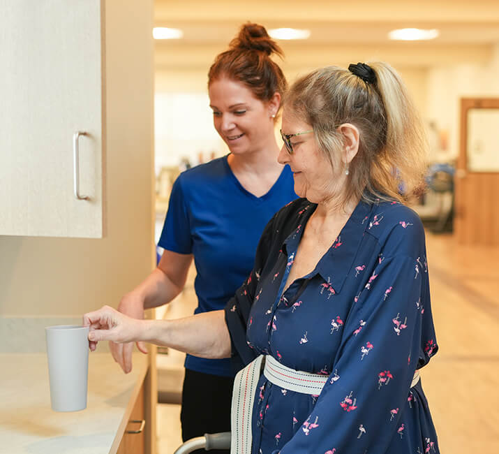 Senior woman putting away a cup