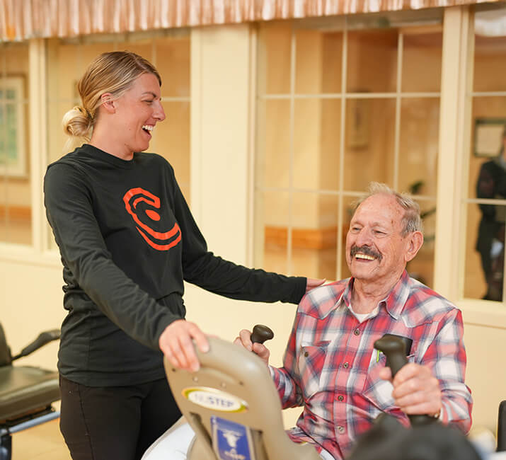 therapist working with senior man