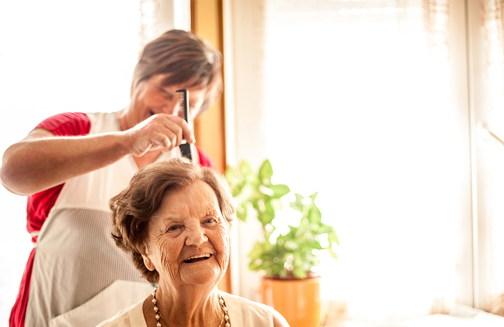 Senior woman getting a haircut