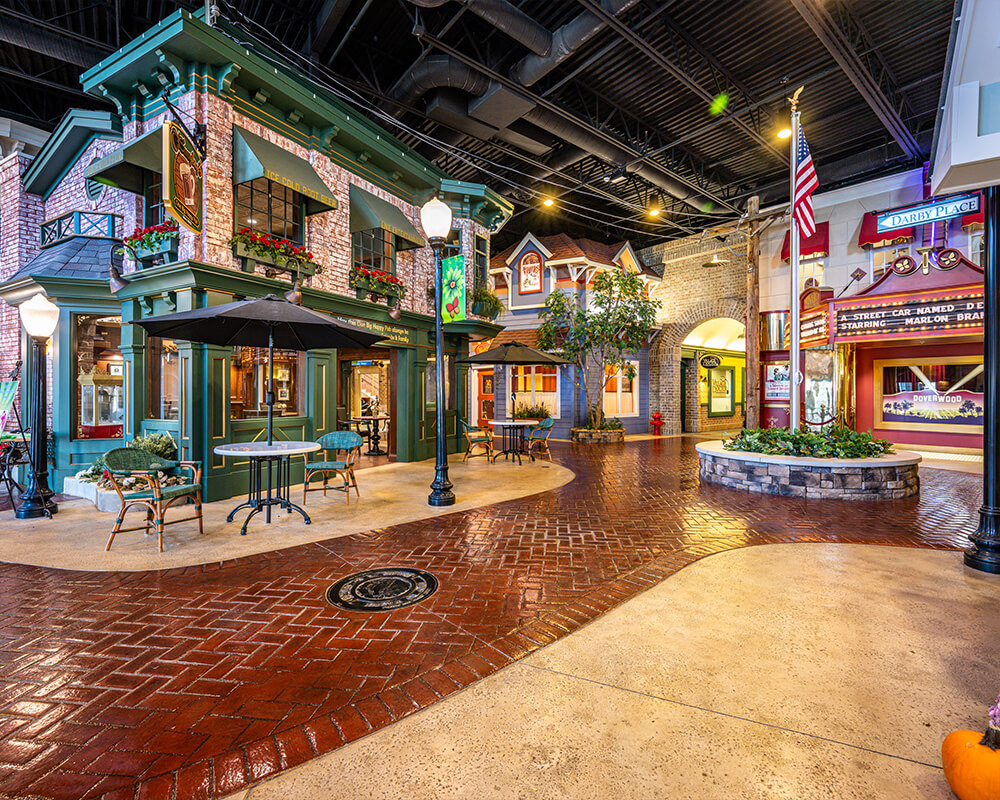 Charming indoor courtyard with shops and units in a vibrant community setting.