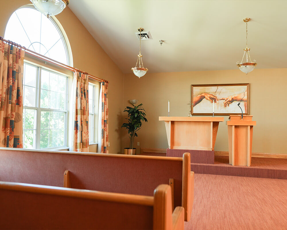 Serene chapel with altar inside a senior living communitys unit.